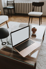 Wall Mural - Laptop computer with blank screen on table. Aesthetic influencer styled workspace interior design template with mockup copy space