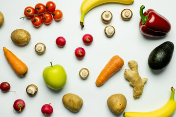 Wall Mural - Top view o fresh vegetables and fruits on white background.