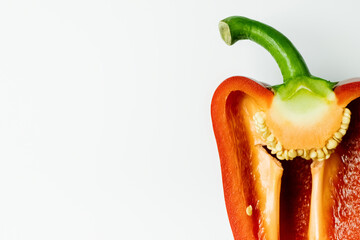 Wall Mural - Close up view of cut ripe bell pepper isolated on white.