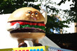 a giant hamburger statue at a food festival 