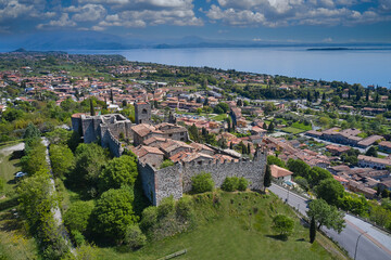 Canvas Print - Side view of the Valtenesi castle. Medieval castle of Padenghe del Garda drone view. Padenghe Castle, Garda lake-Italy. Aerial photography with drone.