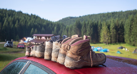Wall Mural - a hiking boots at the car