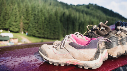 Wall Mural - a hiking boots at the car