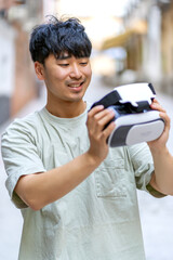 surprised asian with his virtual reality glasses