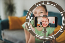 Teenager Girl Making A Video Blog On A Smartphone At Her Home