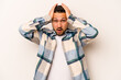 © Asier - Young hispanic man isolated on white background being shocked, she has remembered important meeting.