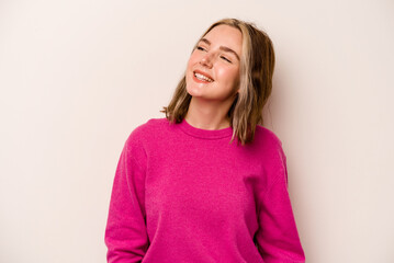 Wall Mural - Young caucasian woman isolated on white background relaxed and happy laughing, neck stretched showing teeth.