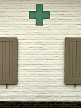 Old Dutch Pharmacy Wall With Cross And Windows