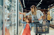 Beautiful woman and child shopping