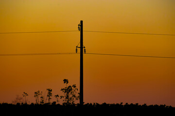 electric pole at sunset. Power line support