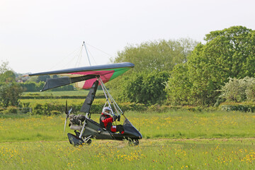 Poster - Ultralight airplane taking off from a farm strip