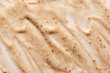 Cosmetic cream scrub for face or body. Textured background