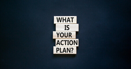 Wall Mural - Action plan symbol. Concept words What is your action plan on wooden blocks. Beautiful black table black background. Business What is your action plan concept. Copy space.