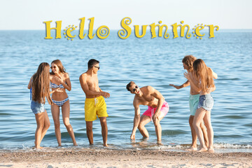 Wall Mural - Happy friends resting on sea beach. Hello, summer