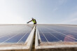 © nikomsolftwaer - worker installing the solar panels.Solar power energy. renewable energy, Solar power plant. worker maintenance of solar power plants who perform inspections and maintenance of solar power plants.