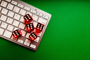 Playing dice and keyboard. Top view. Online gambling and casino concept