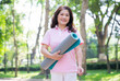 © Timeimage - Image of middle age Asian woman exercise at park