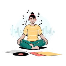 Girl, Young Woman Sitting Cross-legged, Meditating And Listening To Music In Headphones