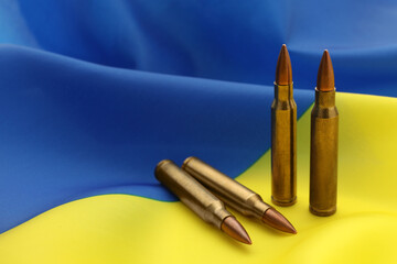 Wall Mural - Bullets on national flag of Ukraine, space for text
