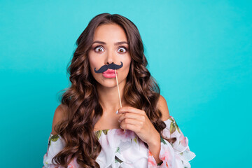 Poster - Photo of cute impressed lady dressed off shoulders holding fake mustaches pouted lips empty space isolated teal color background