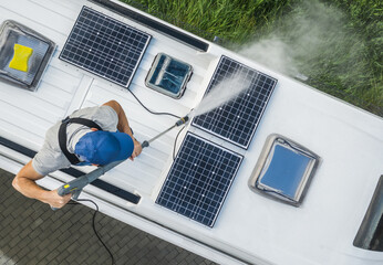 Wall Mural - Men Power Washing His Camper Van RV Roof and Solar Panels