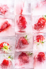 Wall Mural - Three rows of ice cubes with strawberries - Top of view