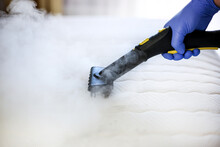 Cleaning And Disinfection Of The Mattress In The Bedroom With Hot Steam. Professional Cleaning Process