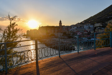 Wall Mural - Sunset view of the fishing village from the Anita Garibaldi Promenade, popular tourist destination in the Italian Riviera, Nervi, Genoa, Liguria, Italy