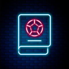 Poster - Glowing neon line Football learning book icon isolated on brick wall background. Colorful outline concept. Vector