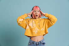 Asian Girl With Pink Hair And Piercing Expressing Surprise At Camera
