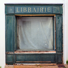 Facade Of An Old Abandoned Bookstore In The Town Of Audierne, In The Finistère Department In The South Of Beautiful Brittany