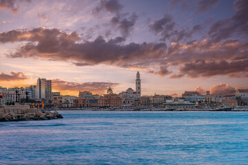 Wall Mural - Panoramic view of Bari, Southern Italy, the region of Puglia(Apulia) seafront at Sunset. Basilica San Nicola in the background. 