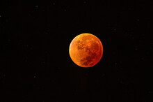Total Lunar Eclipse. Blood Red Moon. Super Moon In The Black Sky. Space View With Stars.
Selective Focus