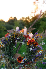 Canvas Print - Flower wreath with burning candles on evening meadow. Summer Solstice Day, Midsummer concept. floral traditional festive decor. pagan witch traditions, wiccan symbolic ritual