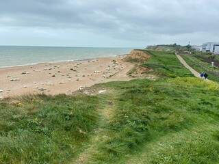 glyne gap beach , West St. Leonards, East Sussex, UK -  beautiful shingle pebble beach with beach huts boats 