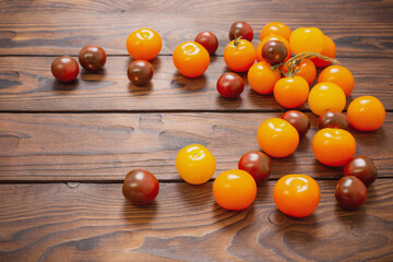 Wall Mural - various tomatoes on dark wooden table