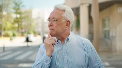 Poster - senior man standing with doubt expression at street