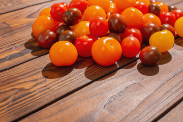 Wall Mural - various tomatoes on dark wooden table