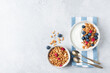 Healthy breakfast Greek yogurt bowl with granola and berries. Top view copy space for text or design elements. Clean eating, dieting concept