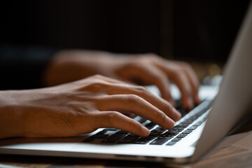 professional business person typing on computer laptop desk at office, using keyboard technology for