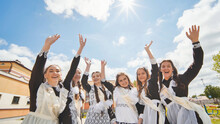 Happy Russian School Graduates Are Stretching Their Hands On Their Last School Day.