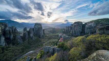 Wall Mural - Time lapse of sunset over the stunning Meteora landscape in Greece, with monasteries built on top of rocks 