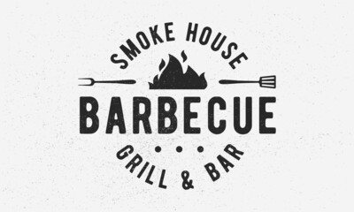 Wall Mural - Barbecue Grill - vintage logo concept. Logo of Barbecue, Grill, Smoke House with fire flame, grill fork and spatula. BBQ logo, poster, stamp template. Vector illustration