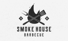 Smoke House - Vintage Logo Concept. Logo Of Barbecue, Grill, Smoke House With Fire Flame, Grill Fork And Spatula. BBQ Logo, Poster, Stamp Template With Grunge Texture. Vector Illustration