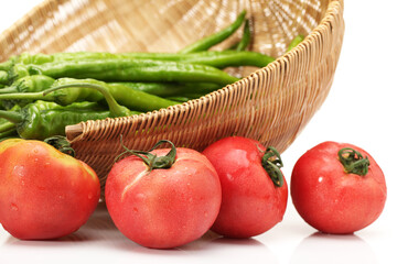 fresh tomato and green peppers isolated on white background