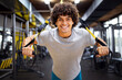 © NDABCREATIVITY - Muscular bodybuilder handsome man doing exercises in gym. Sport people workout concept