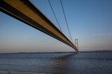 the Humber bridge crossing the river Humber during sunset