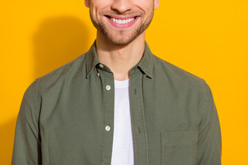 Poster - Cropped view portrait of attractive cheerful glad guy healthy white teeth isolated over vivid yellow color background