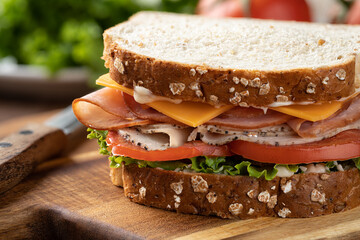 Turkey and ham sandwich on whole grain bread