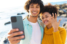 Boyfriend Talking Selfie While Afro African American Girlfriend Showing Off Her Engagement Ring